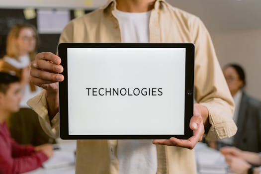 Business professionals discussing technologies, shown on a tablet in an office setting.
